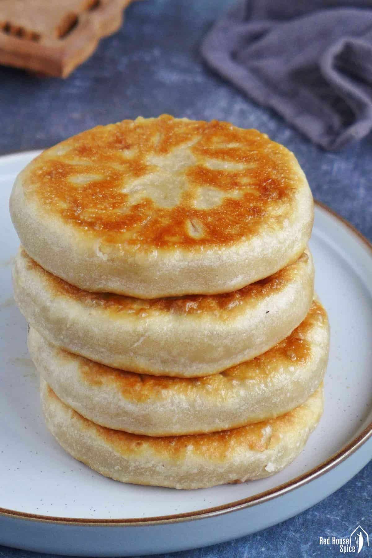 cooked meat pies in a pile.