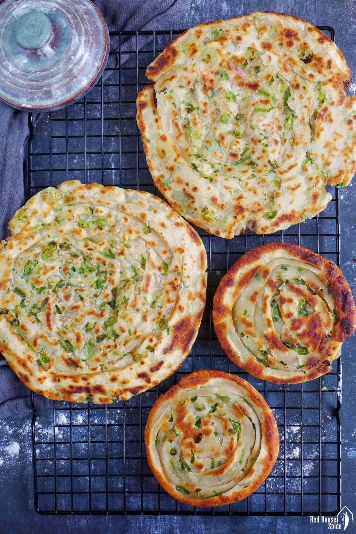 Two thick scallion pancakes and two thin ones