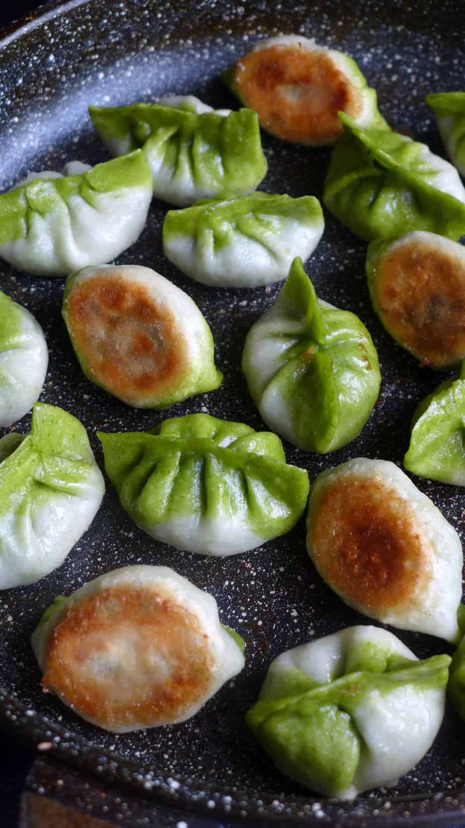 Pan-fried vegetarian dumplings in two colours
