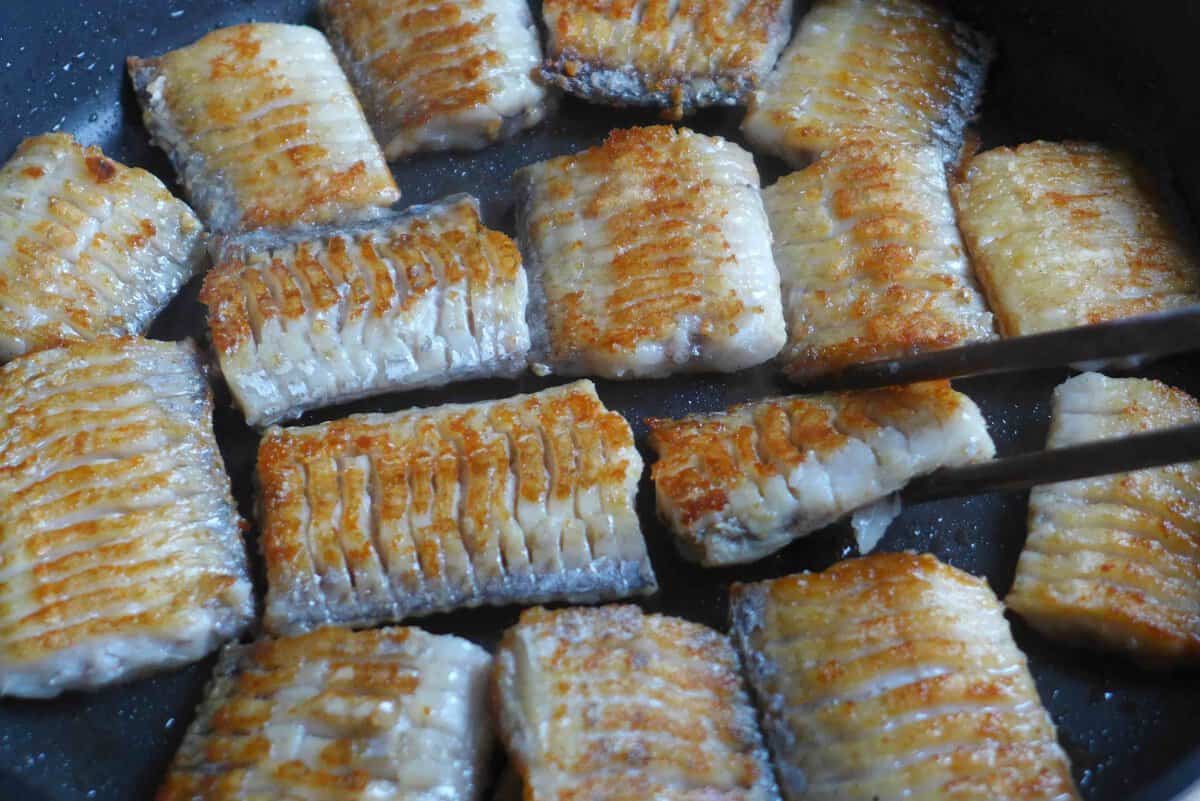 pan-frying belt fish in oil.