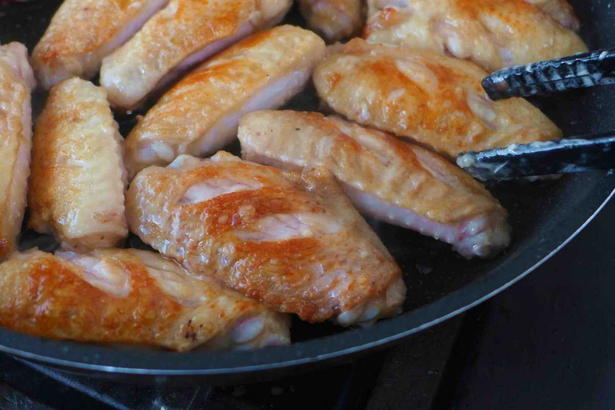 pan-frying chicken wings.