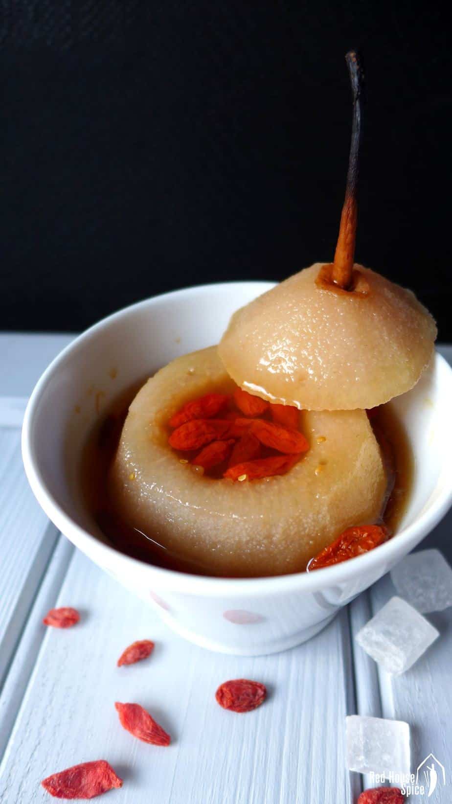 A steamed pear with goji berries inside