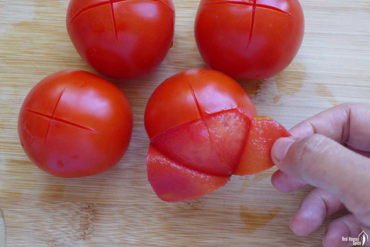 peeling skin off a tomato
