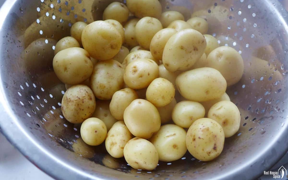 cooked baby potatoes in a colander