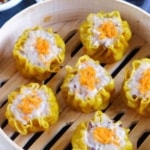 Siu Mai in steamer with overlay text that says pork and shrimp Siu Mai.