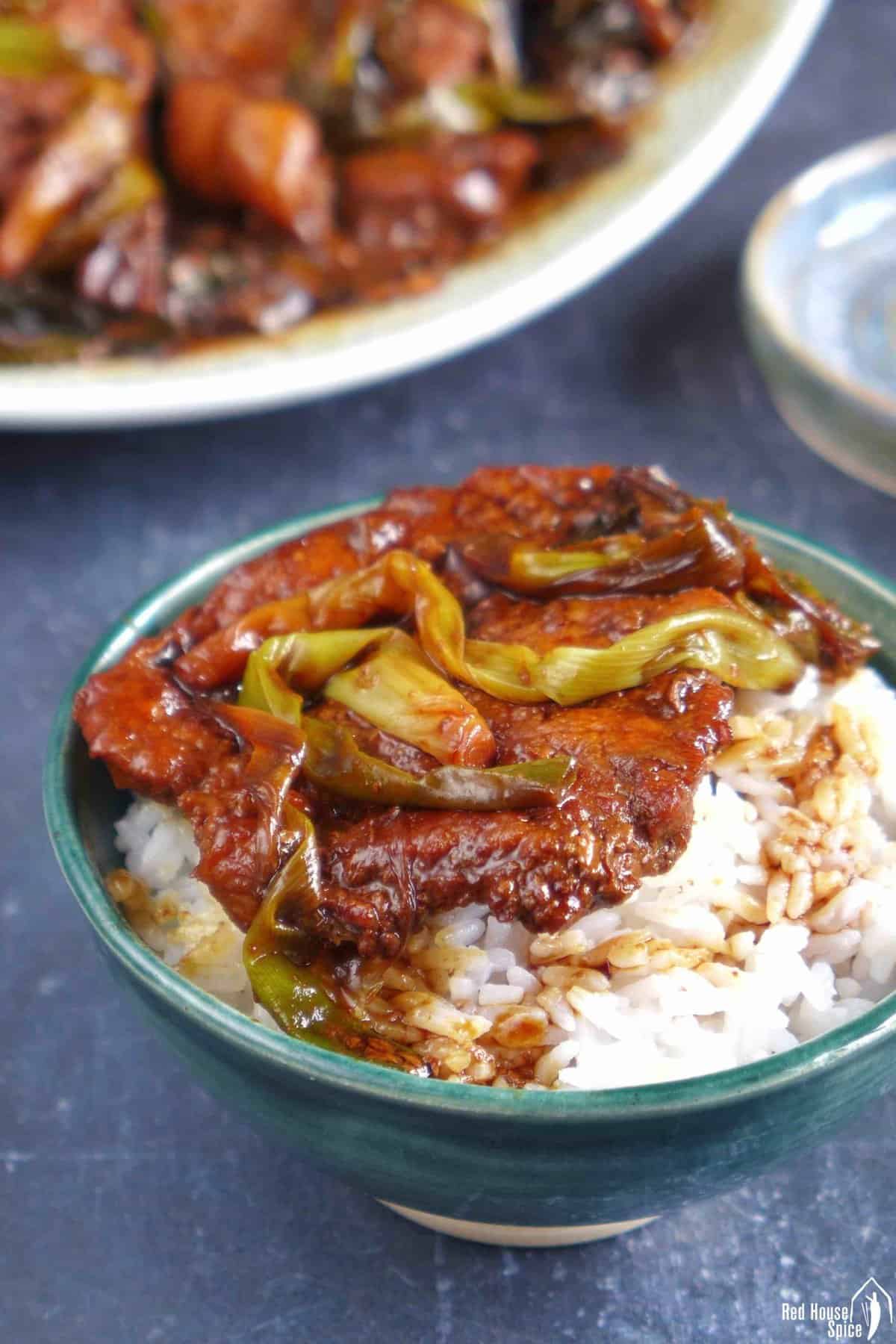 scallion pork chop over steamed rice.