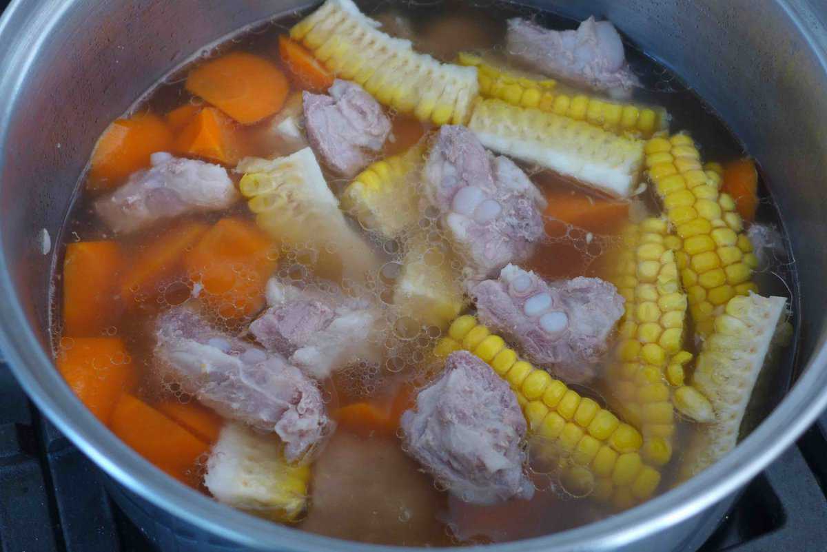 pork ribs, corn and carrot in soup.