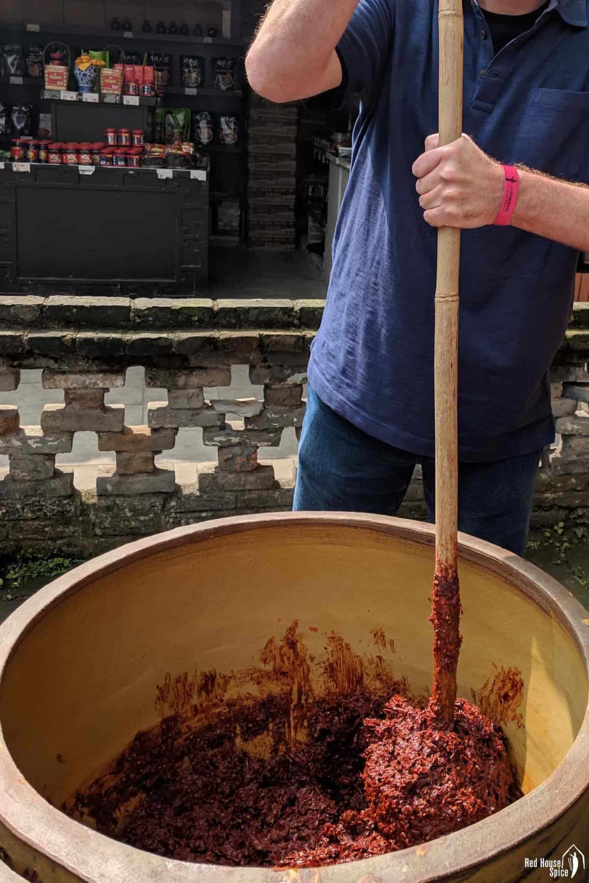 pounding Sichuan chilli bean paste