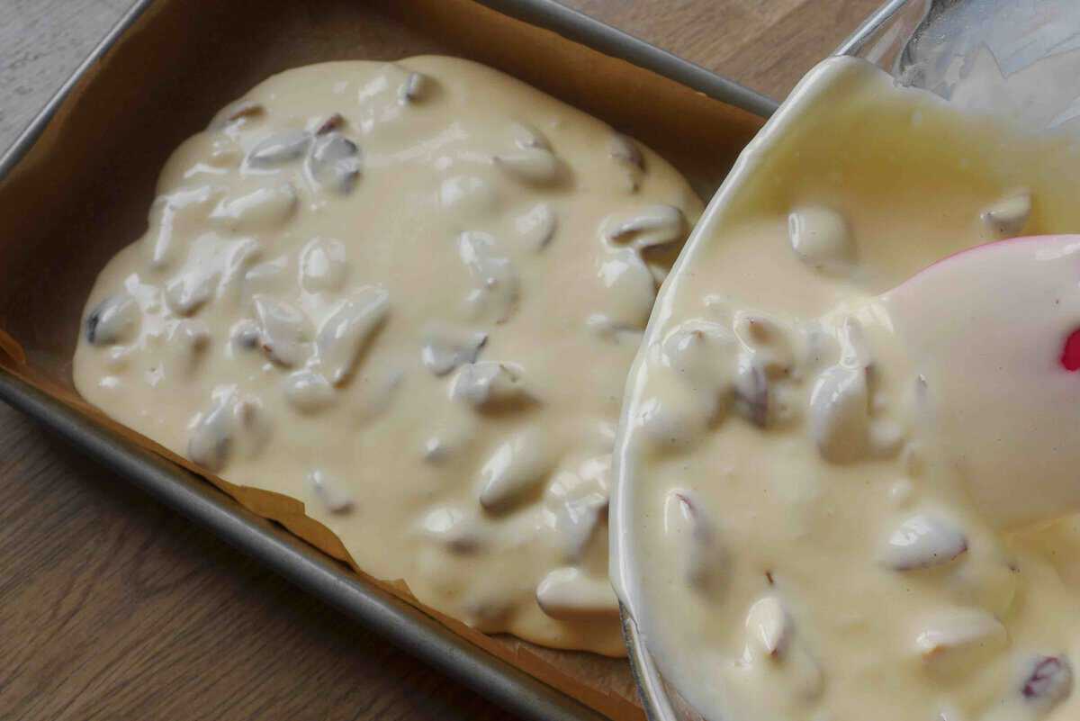 pouring batter into a baking dish.