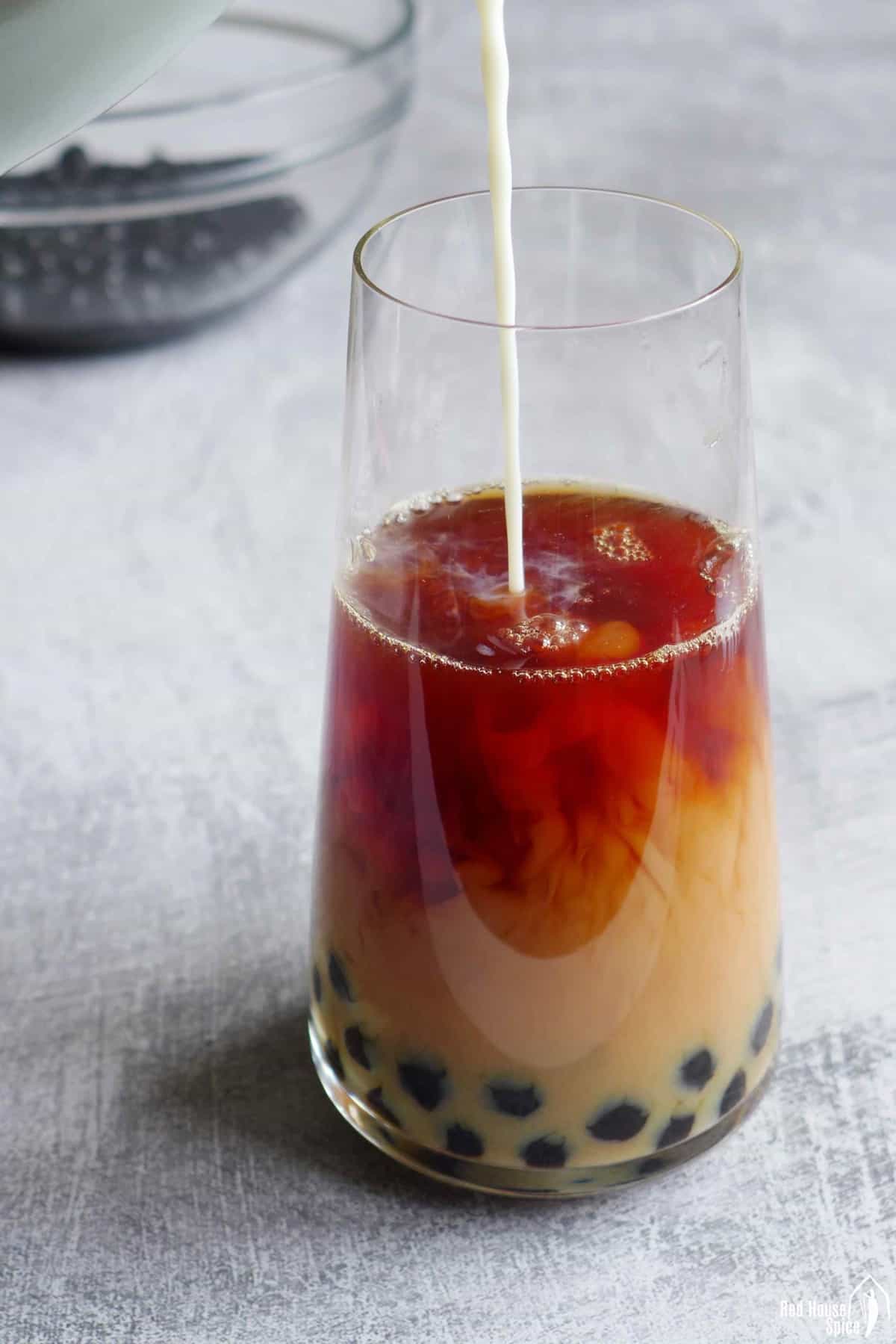 pouring milk into tea