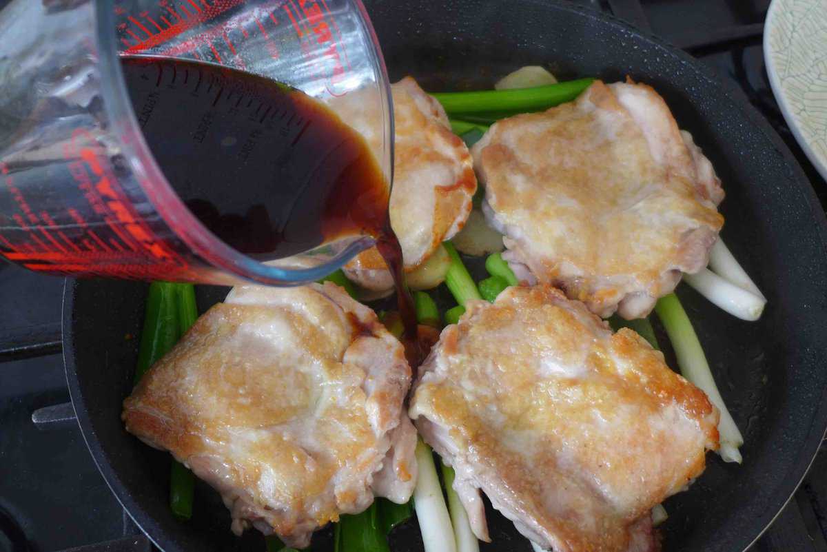 pouring sauce into skillet.