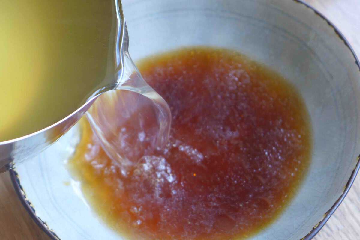 pouring stock into a bowl.