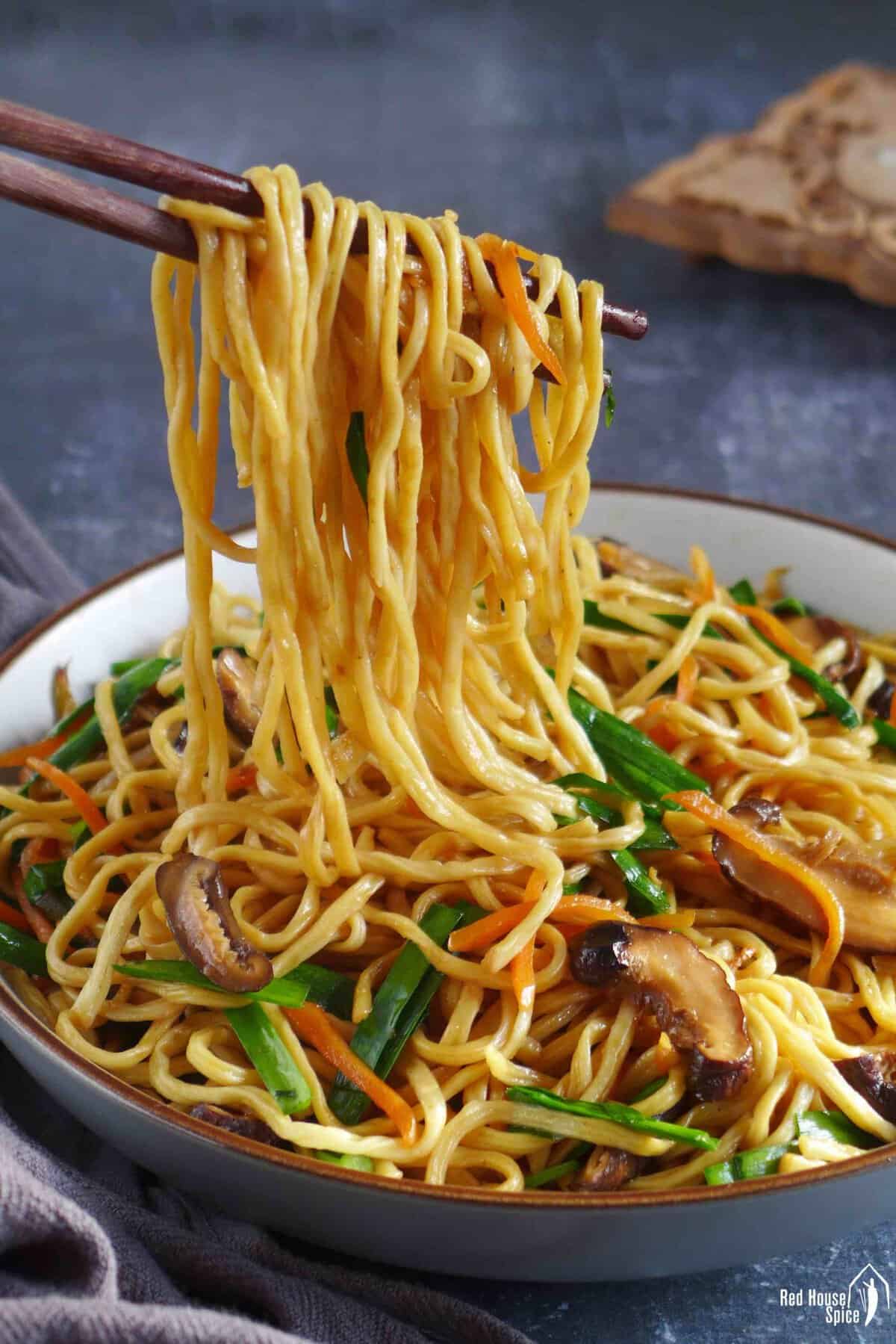 chopsticks pulling longevity noodles.