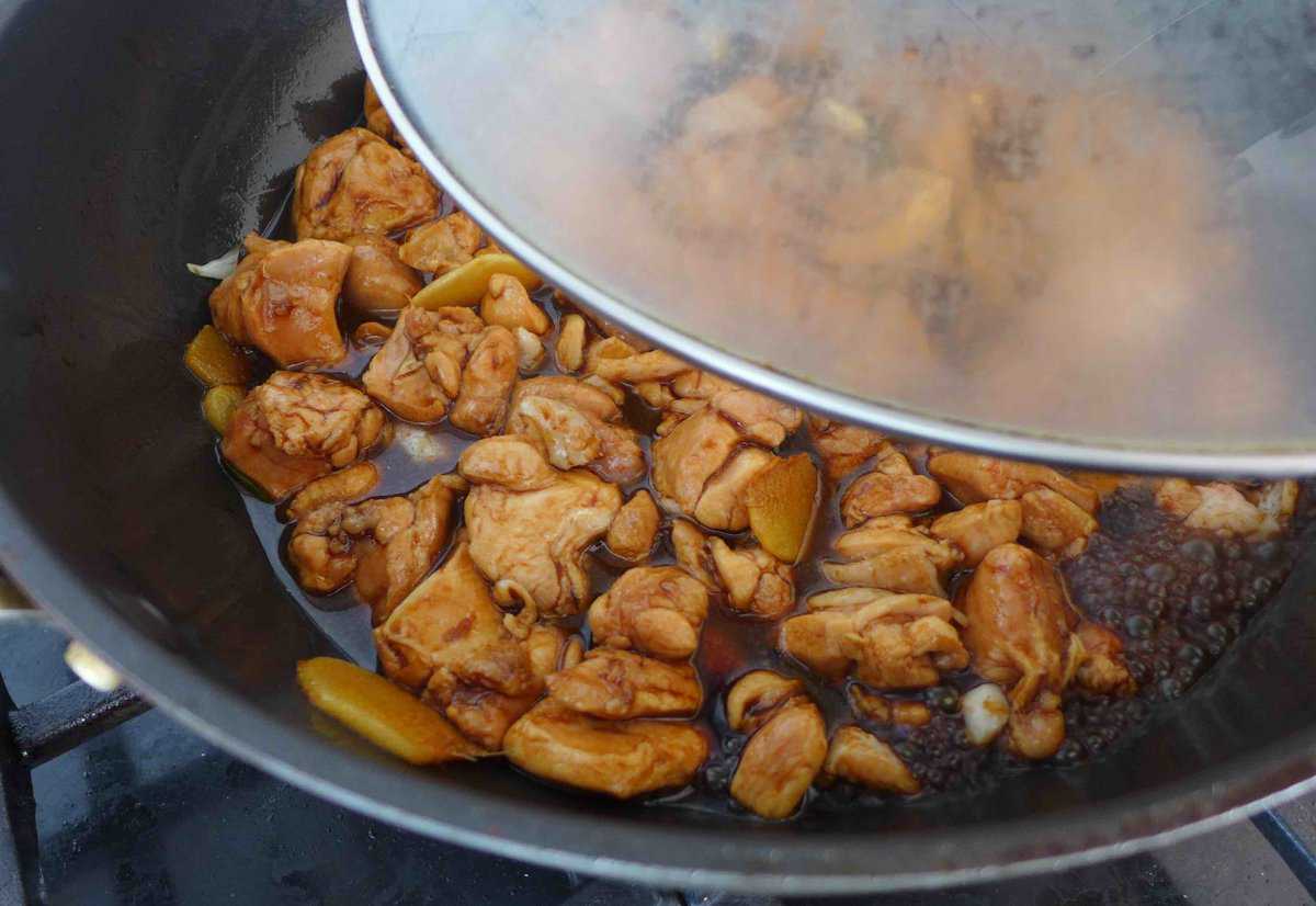 cover a wok with a lid.