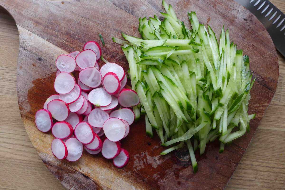 julienned cucumber and sliced red radish.