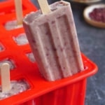 Pulling a red bean popsicle out of a mold.