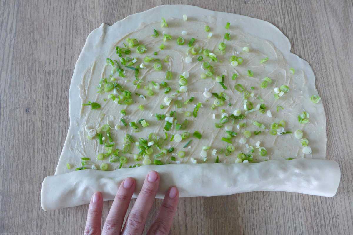 rolling up a piece of dough