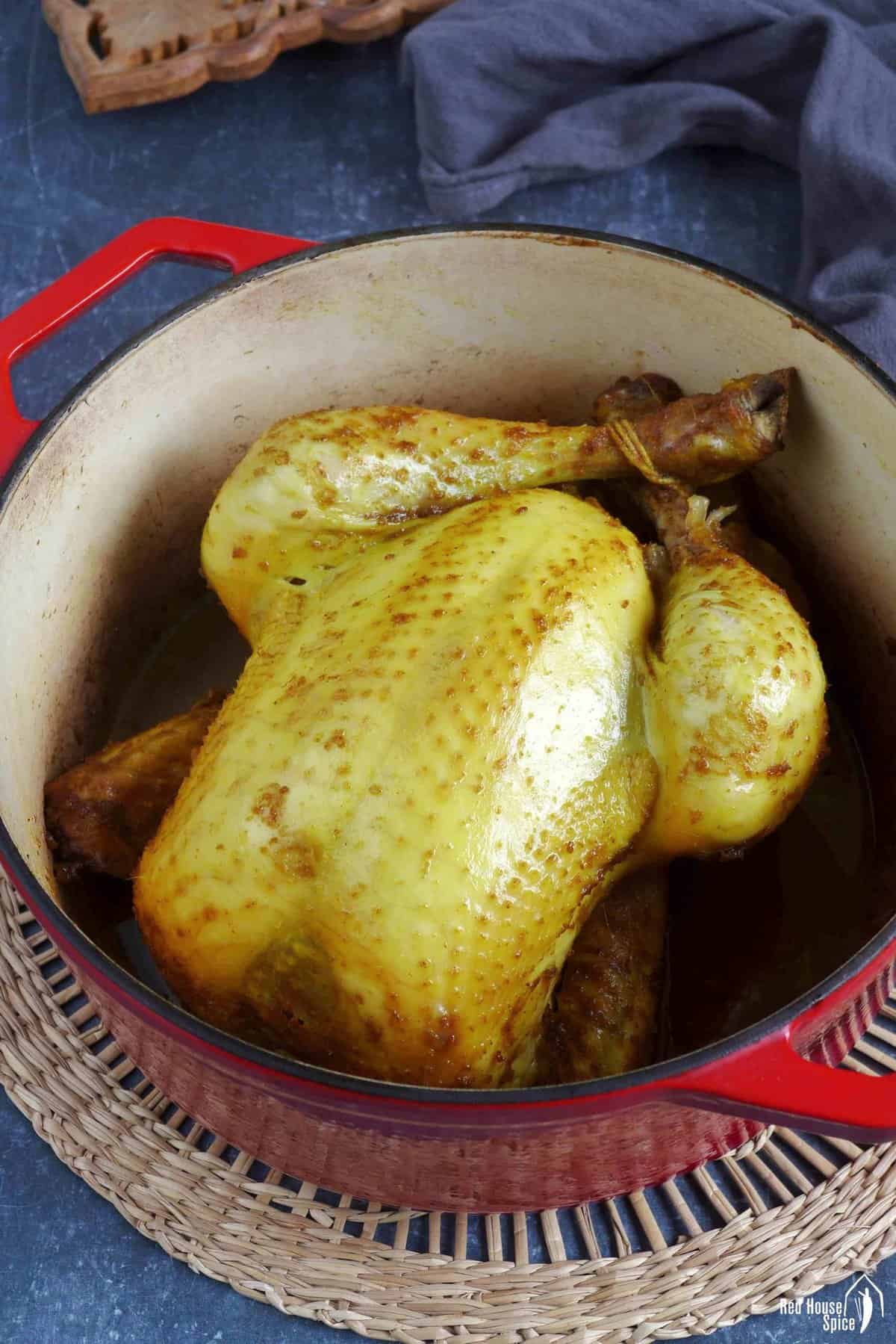 salt baked chicken inside a pot.