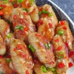 pan fried chicken wings with overlay text that says salt and pepper wings.