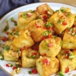 A plate of Chinese salt and pepper tofu with text overlay that says salt and pepper tofu.