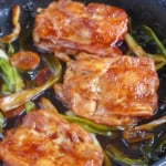 scallion chicken chops in skillet.