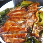 scallion chicken chops over steamed rice with overlay text that says scallion chicken chops.