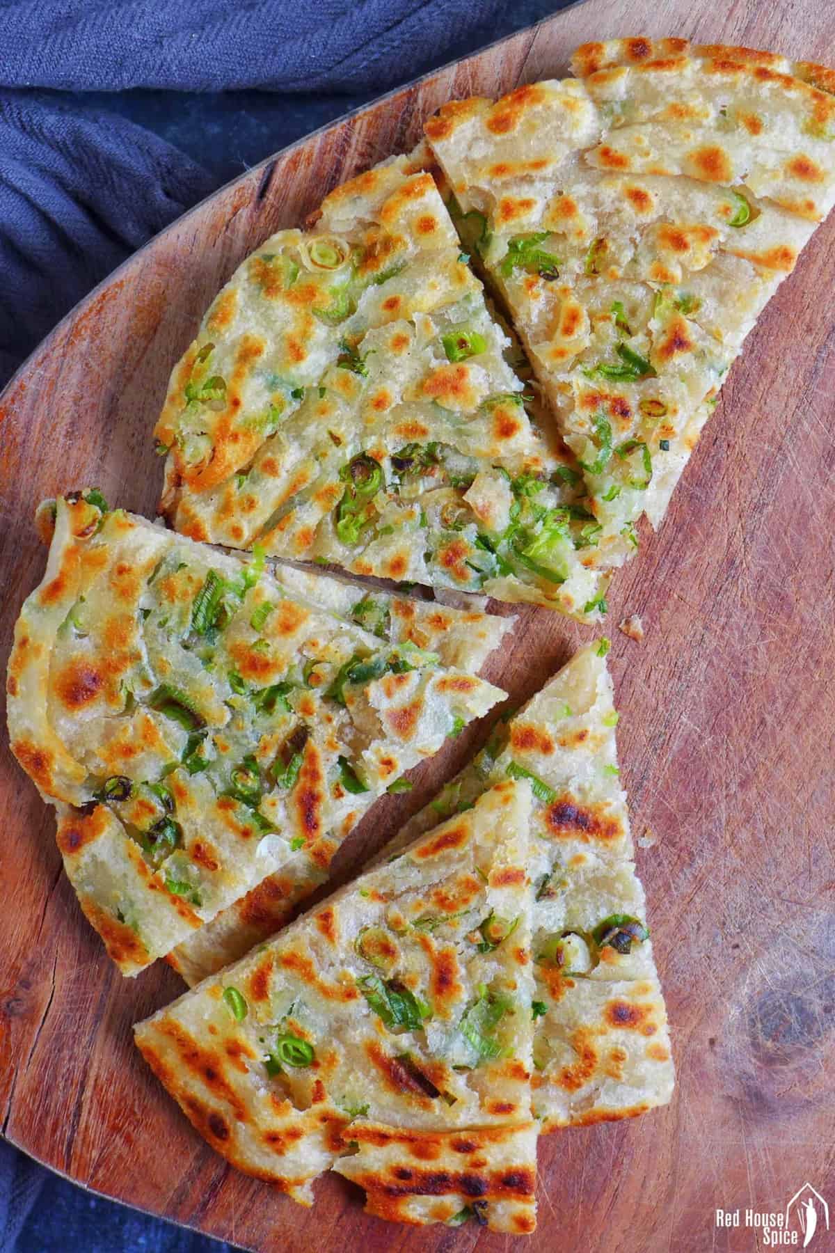 thin scallion pancakes cut into wedges