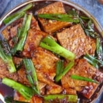 Tofu braised with scallions with overlay text that says scallion tofu.
