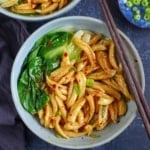 A bowls of scissor cut noodles with Bok Choy