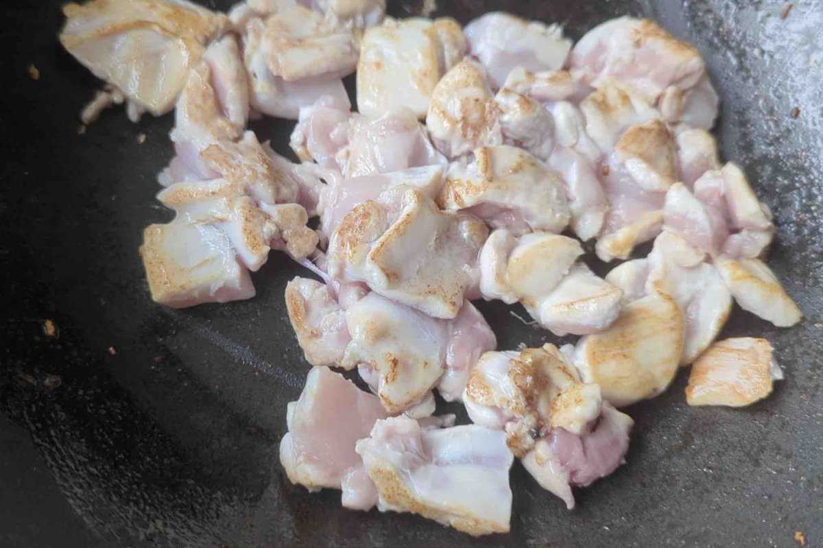searing chicken pieces.