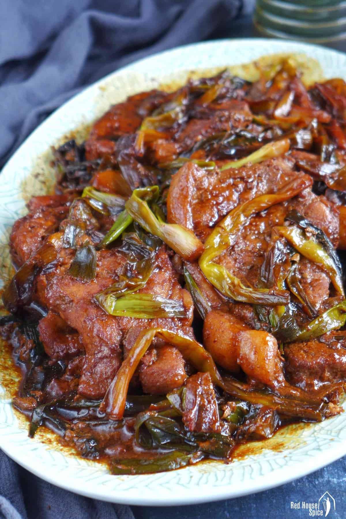 a plate of scallion pork chops.