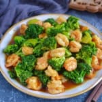 stir-fried shrimp and broccoli on a plate.