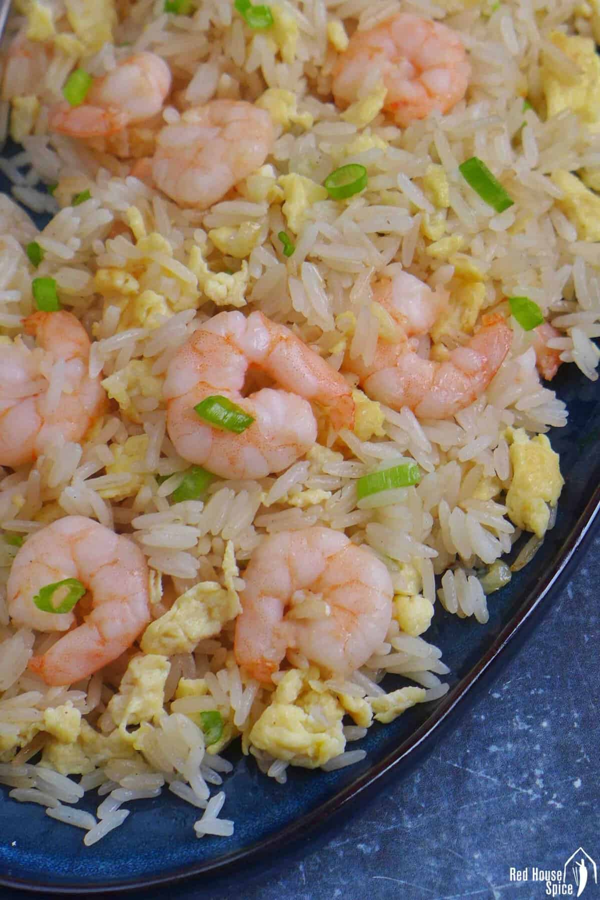 shrimp fried rice on a plate.