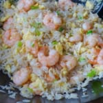 shrimp fried rice in a wok.