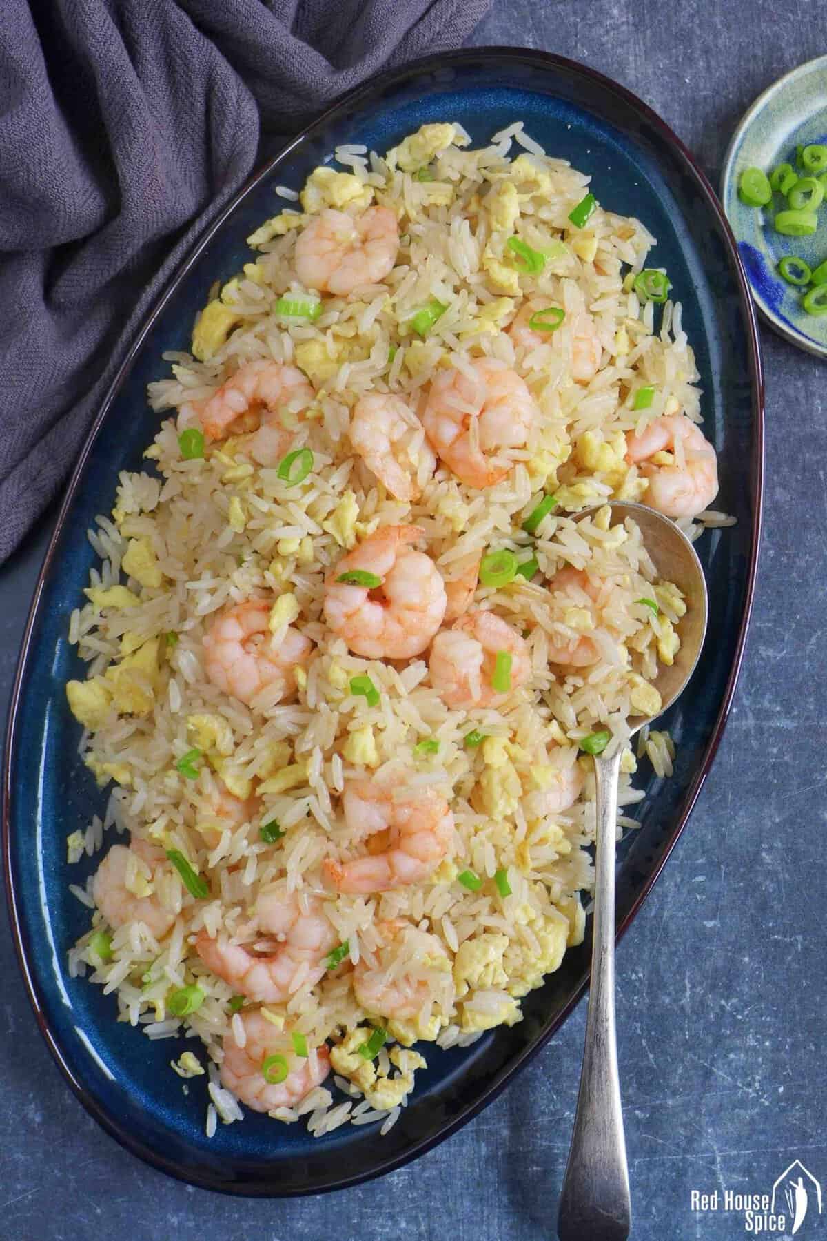 shrimp fried rice on a plate.