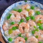 shrimp, peas, pork in a thick sauce with overlay text that says shrimp in lobster sauce.