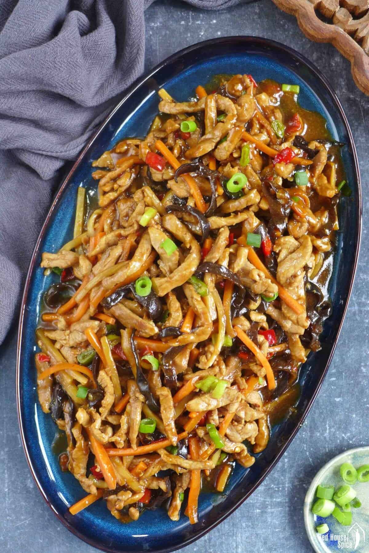 Sichuan Shredded Pork with garlic sauce on a plate.