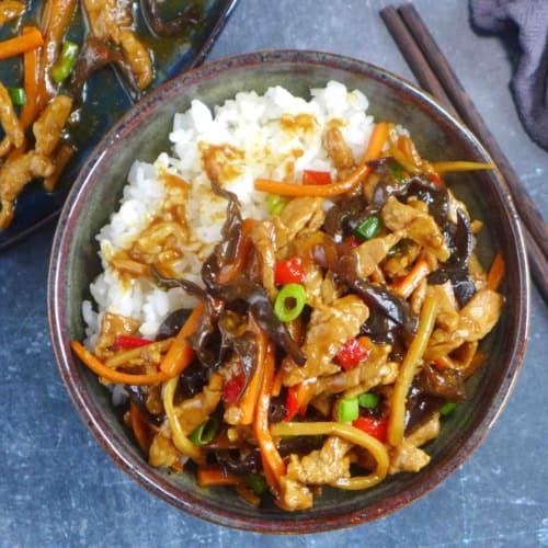Sichuan Shredded Pork with garlic sauce over rice in a bowl.