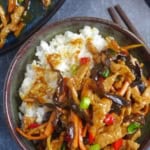 Sichuan Shredded Pork with garlic sauce over rice with overlay text that says garlic sauce pork.