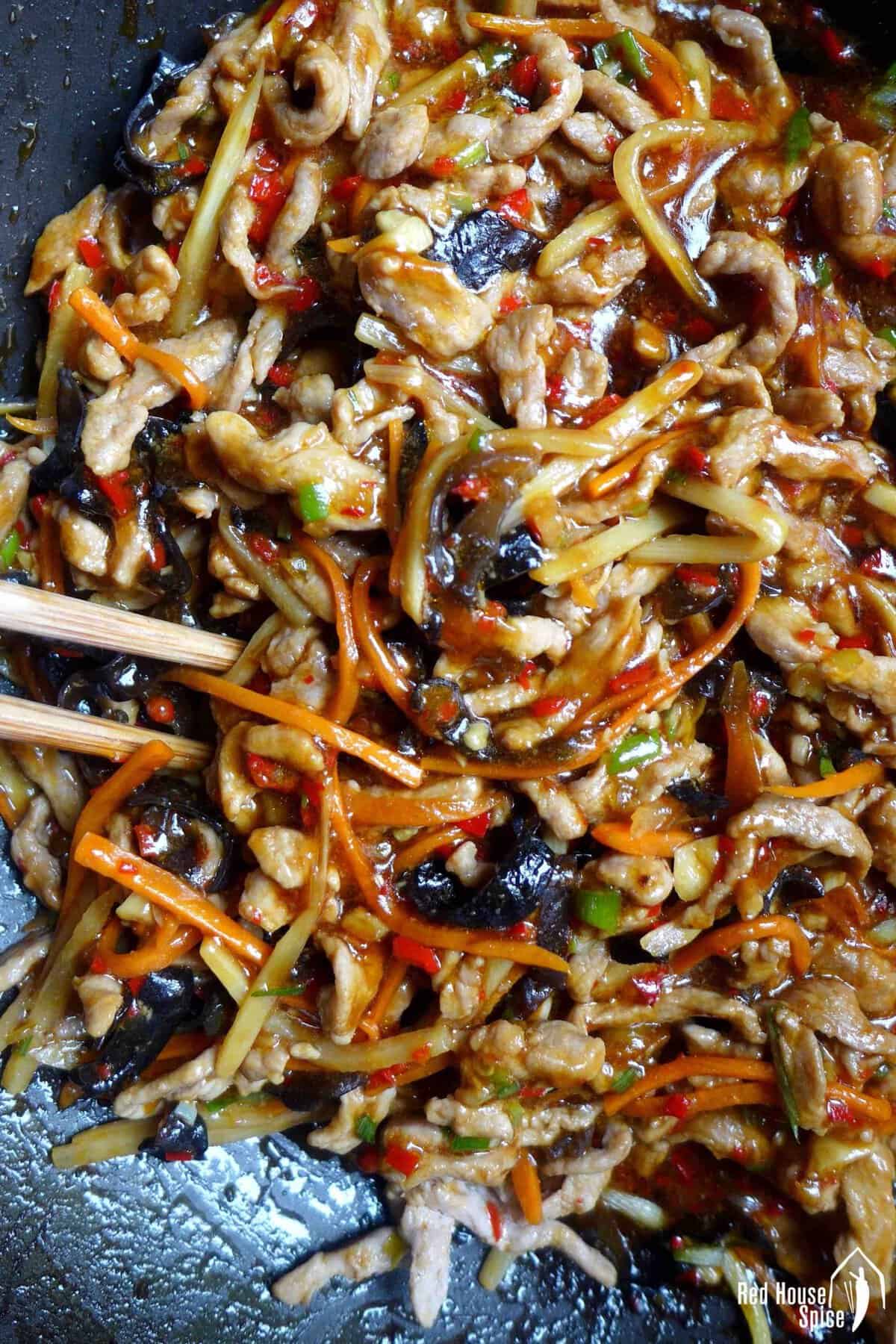 Sichuan Shredded Pork with garlic sauce in a wok.