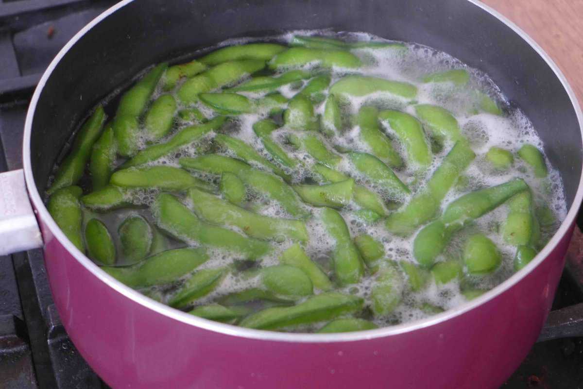 simmering edamame in water.