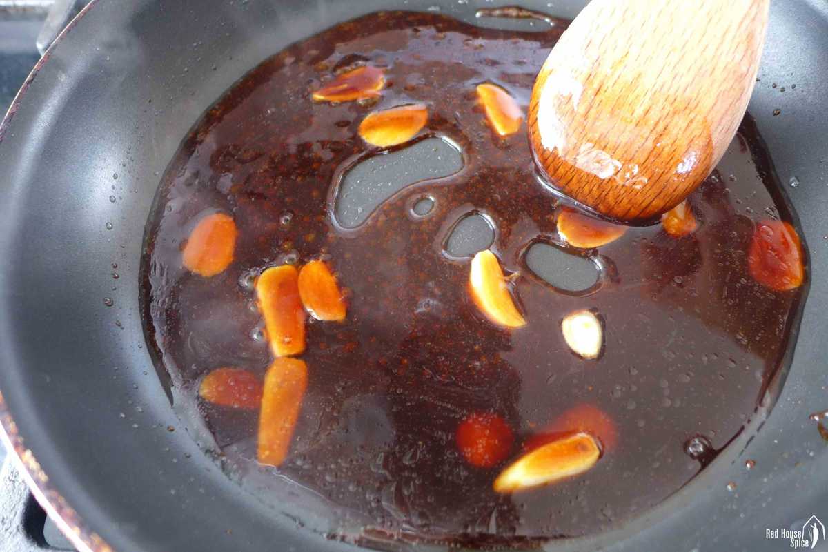 simmering sauce with garlic.