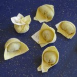 six wontons folded in different ways.