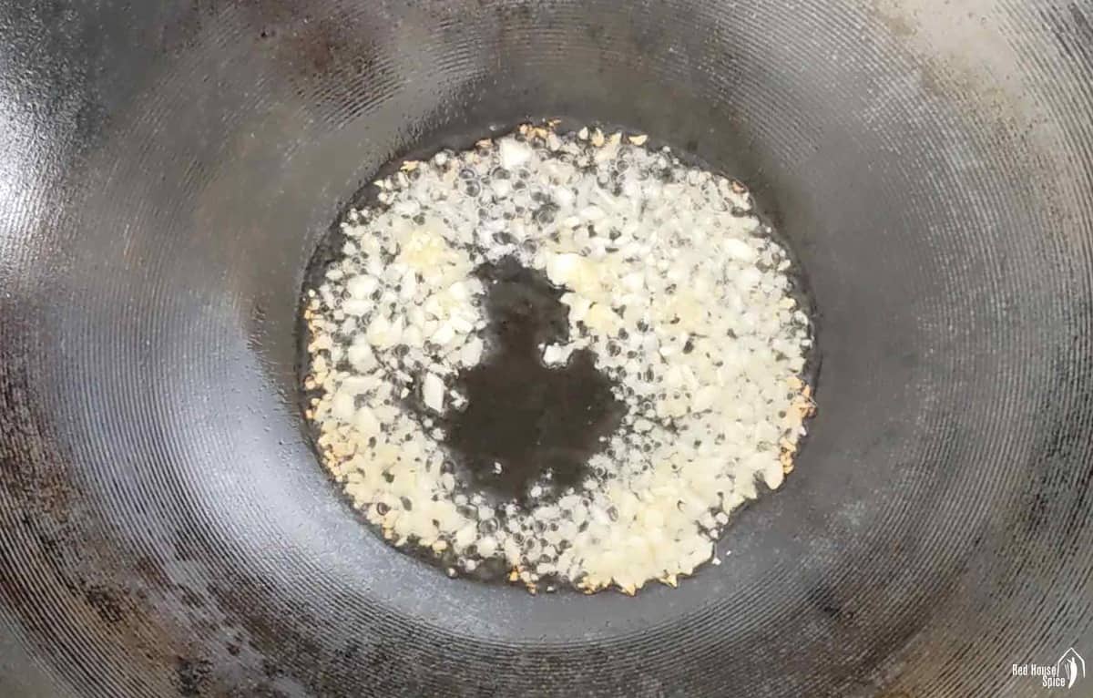 sizzling ginger and garlic in oil.