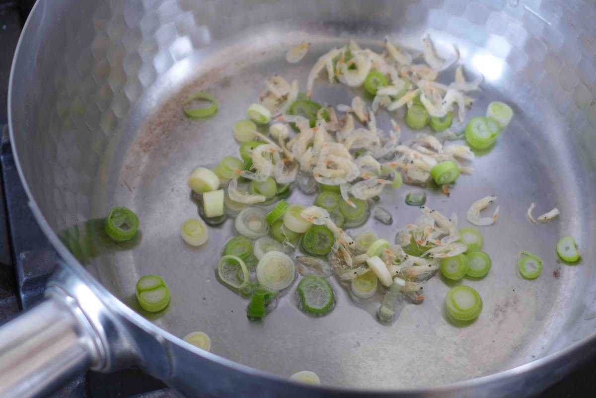 sizzling scallions and dried shrimp in oil.