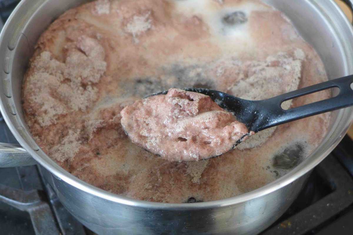 Skimming off foam when blanching beef.