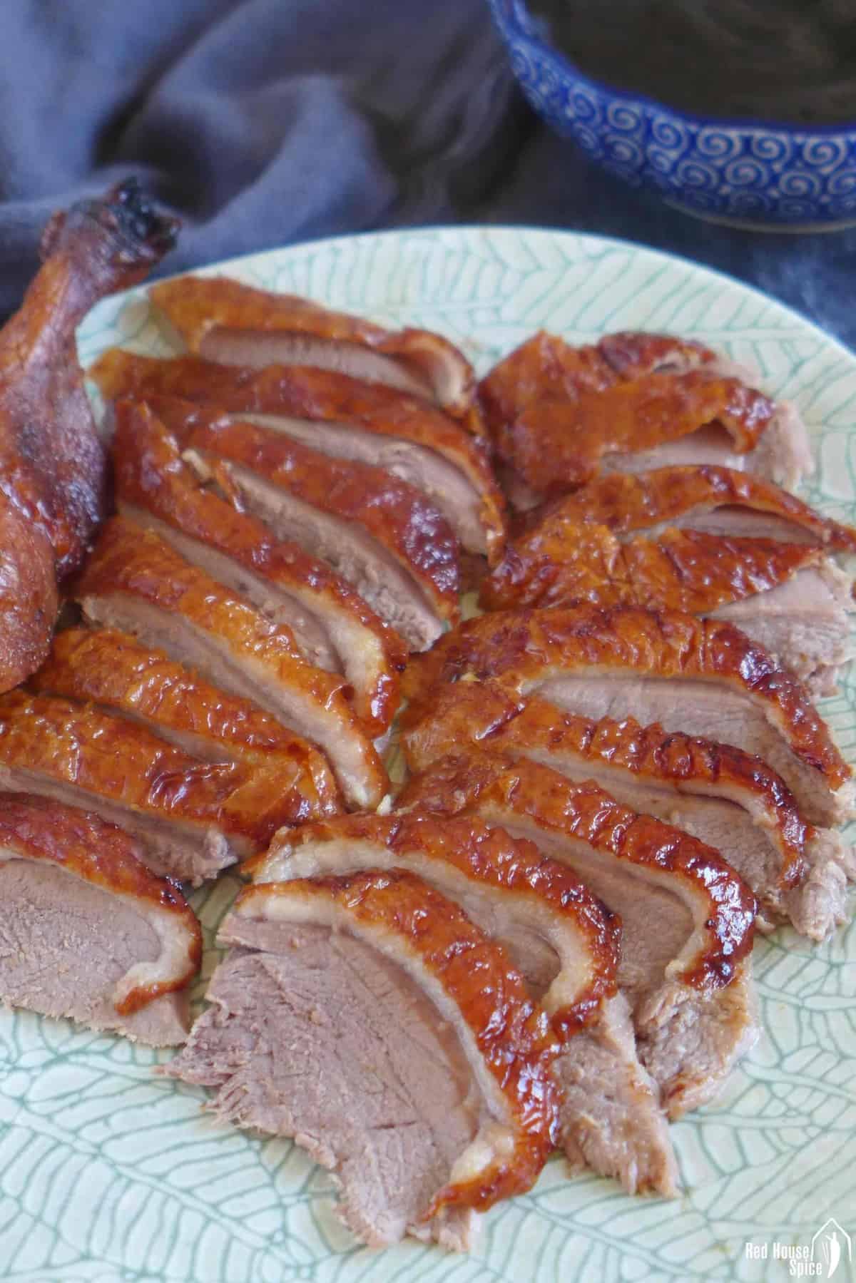 Sliced roast Peking duck on a plate