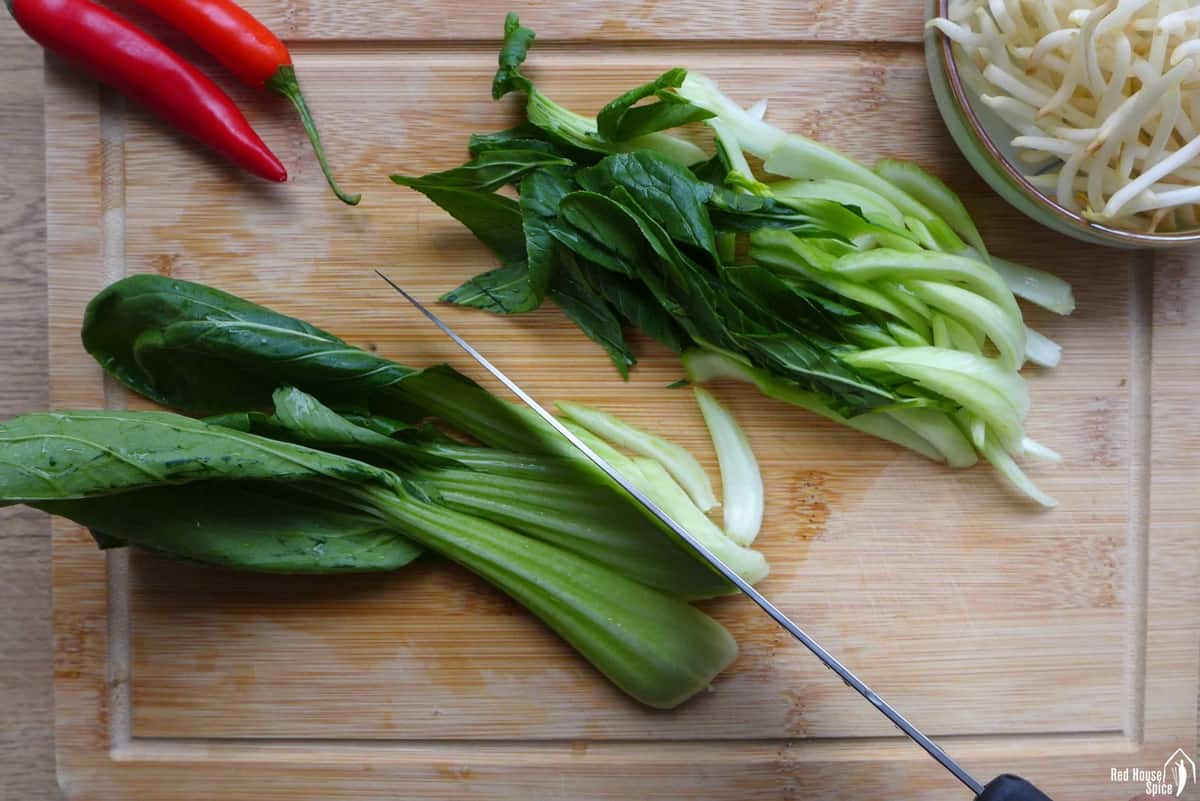 slicing bok choy.