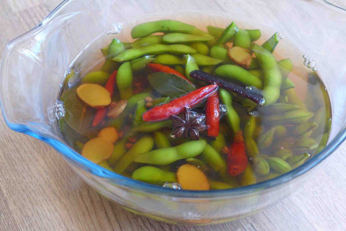 soaking edamame in spiced water.