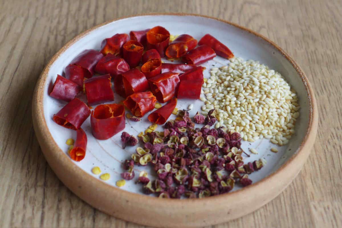 dried chili, sichuan pepper and sesame seeds.
